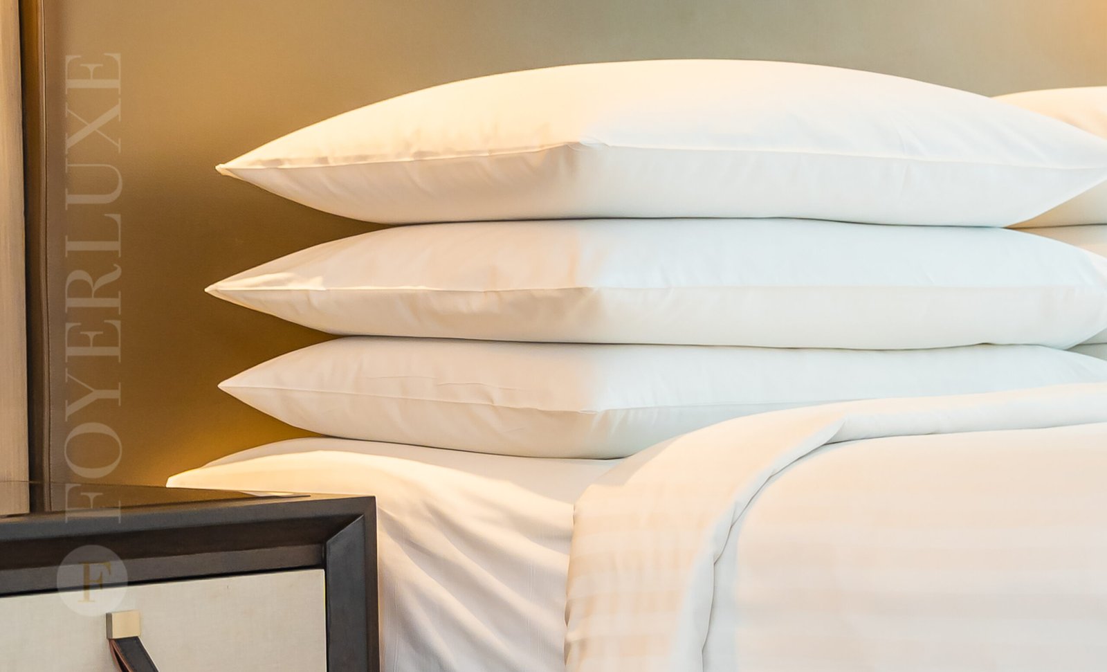 A peaceful bedroom with beige colors and simple design.